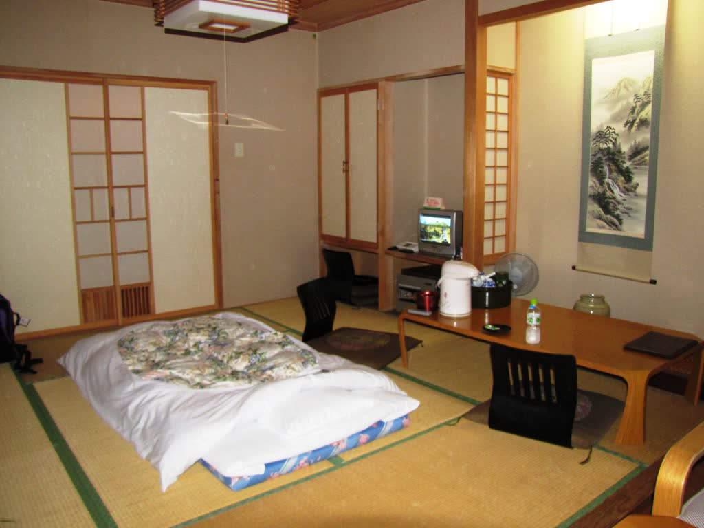 Traditional minshuku tatami room with futons