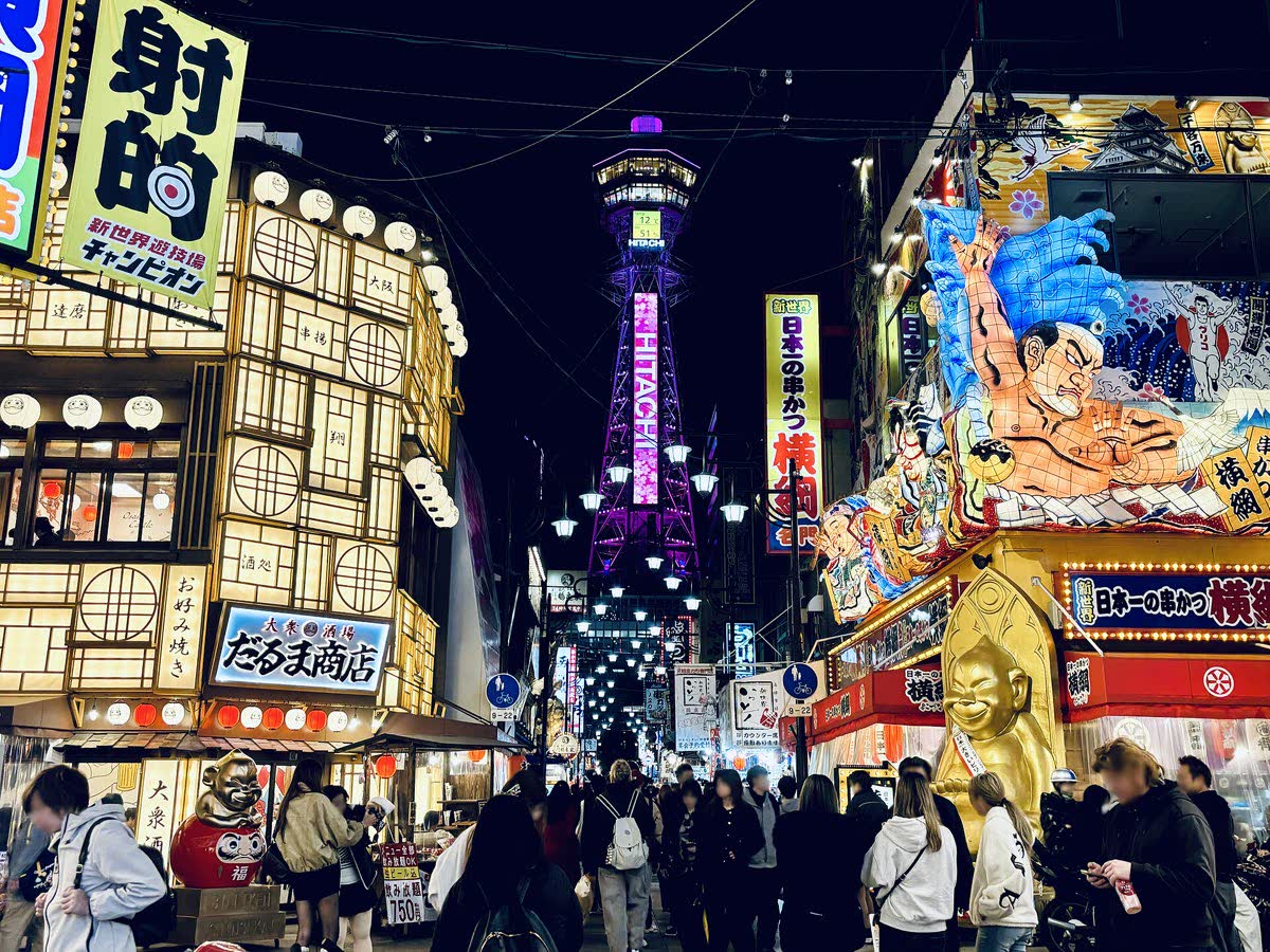 Shinsekai district at night with Tsutenkaku Tower